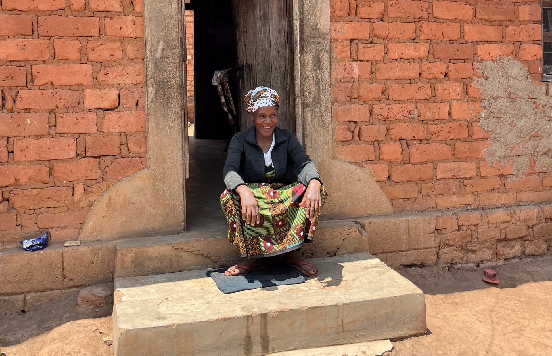 woman in front of a house